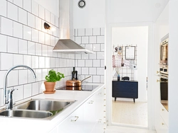 Kitchen interior with white tiles photo