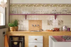 All the walls are tiled in the kitchen photo