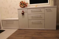 Chest of drawers in the hallway with a mirror in a modern style photo