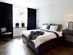 Dark bed in the bedroom interior photo design