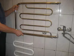 How to hang a heated towel rail in the bathroom photo