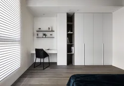 Wardrobe with table in the bedroom photo