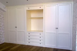 Wardrobe with hinged doors in the living room photo