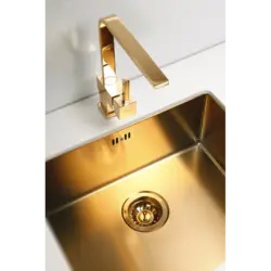 Gold sink in the kitchen photo