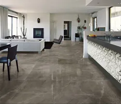Gray porcelain tiles on the floor in the interior of the apartment