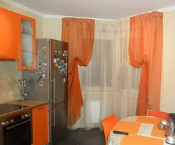 Kitchen design with orange curtains