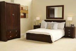 Light bedroom design with dark bed