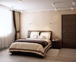 Light bedroom design with dark bed