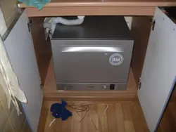 Dishwasher under the kitchen sink photo