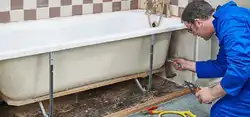 Installation of a bathtub in the bathroom photo