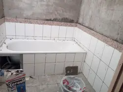 Installation of a bathtub in the bathroom photo