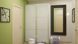 Green wardrobe in the hallway interior