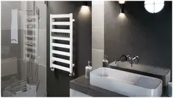 White heated towel rail for bathroom photo
