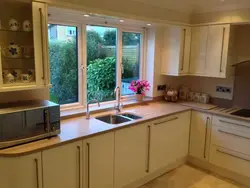 Photo of a kitchen with a window on the right