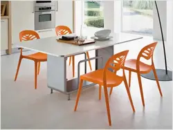 Orange chairs in the kitchen photo