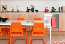 Orange chairs in the kitchen photo