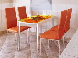 Orange chairs in the kitchen photo
