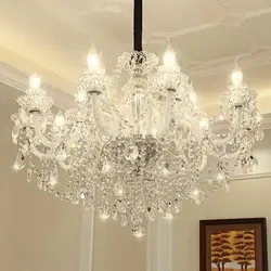 White chandeliers in the living room photo