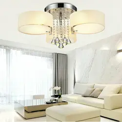 White chandeliers in the living room photo