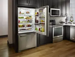 Open refrigerator in the kitchen photo