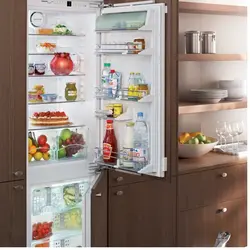 Open refrigerator in the kitchen photo