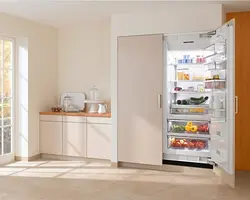 Open refrigerator in the kitchen photo