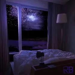 Photo of a bedroom at night with a window