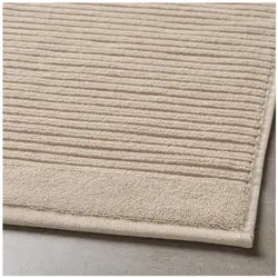 Beige bath mat photo