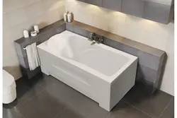 Photo of a bathtub with a tap in the middle