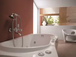 Photo of a bathtub with a tap in the middle