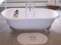 Photo of a bathtub with a tap in the middle