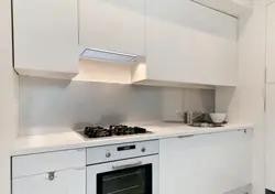 Photo Of A Beige Kitchen With A Hood