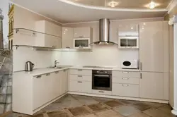 Photo Of A Beige Kitchen With A Hood
