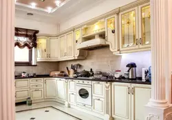 Photo Of A Beige Kitchen With A Hood