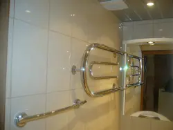 Photo of a heated towel rail in a small bathroom