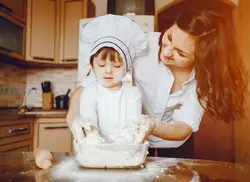 Little girl in the kitchen photo