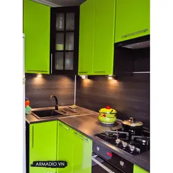 Green Kitchen With Black Countertop Photo