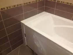 Shelves between the bathroom and the wall photo