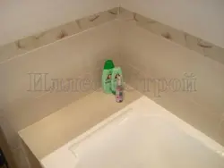 Shelves between the bathroom and the wall photo