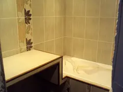 Shelves between the bathroom and the wall photo