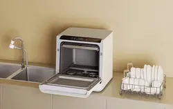 Ас үйдегі ыдыс жуғыш машинаның шағын фотосуреті
