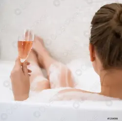 In the bath with a glass of wine photo