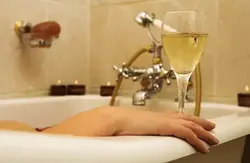 In the bath with a glass of wine photo