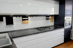 Handles on a white glossy kitchen photo