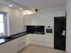 Handles on a white glossy kitchen photo