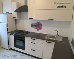 Black handles on a beige kitchen photo