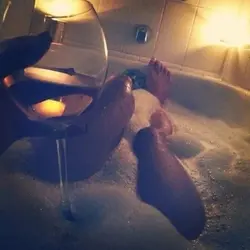 Bath with foam and wine photo