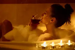 Bath with foam and wine photo