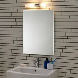 Bathroom mirror with sconce photo