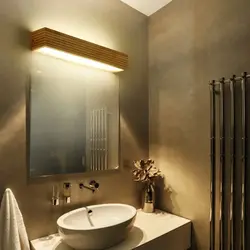 Bathroom mirror with sconce photo